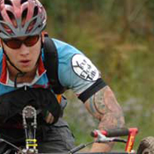 one-off handcycle rider taking it uphill